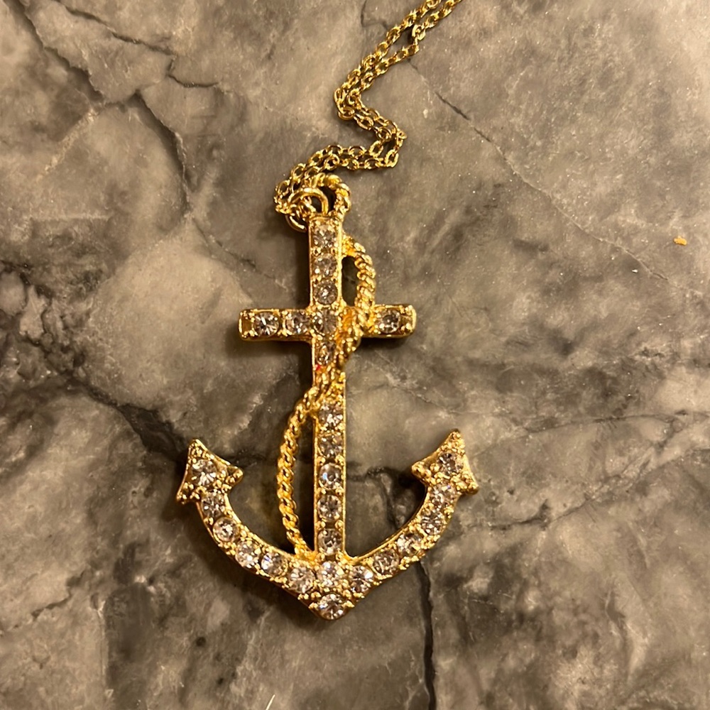 Rhinestone and gold anchor necklace. Chain is 24 inches long. Perfect condition!